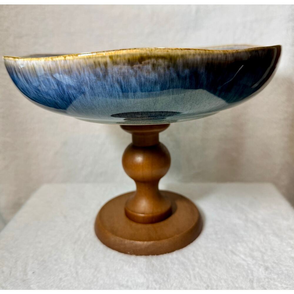 Vintage ceramic pedestal fruit plate with a wood base. 9” High